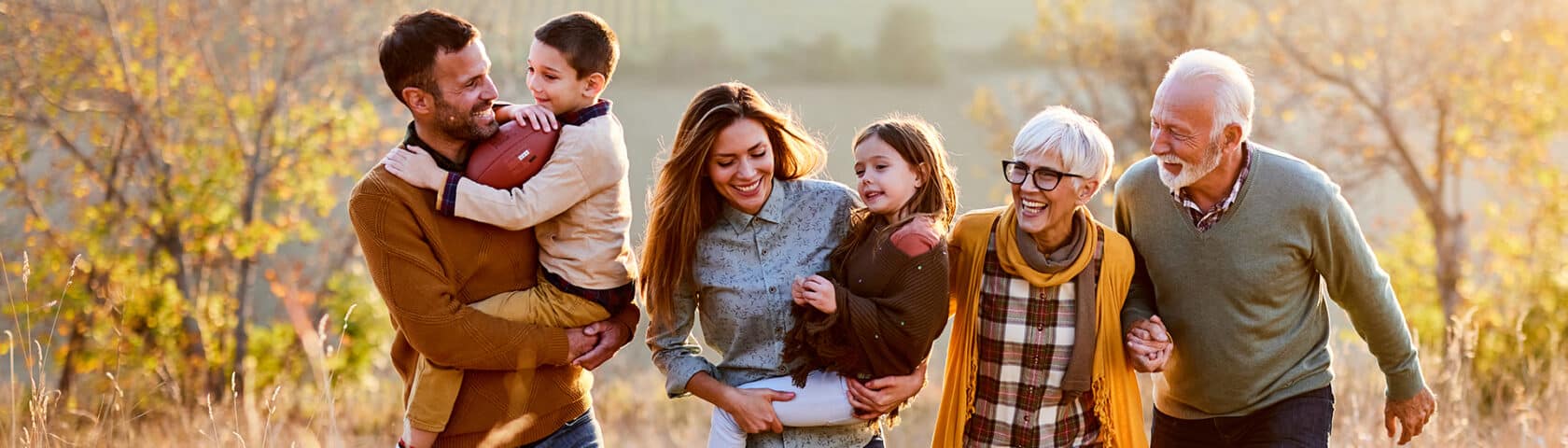 Intergenerational family enjoys being active outdoors together.