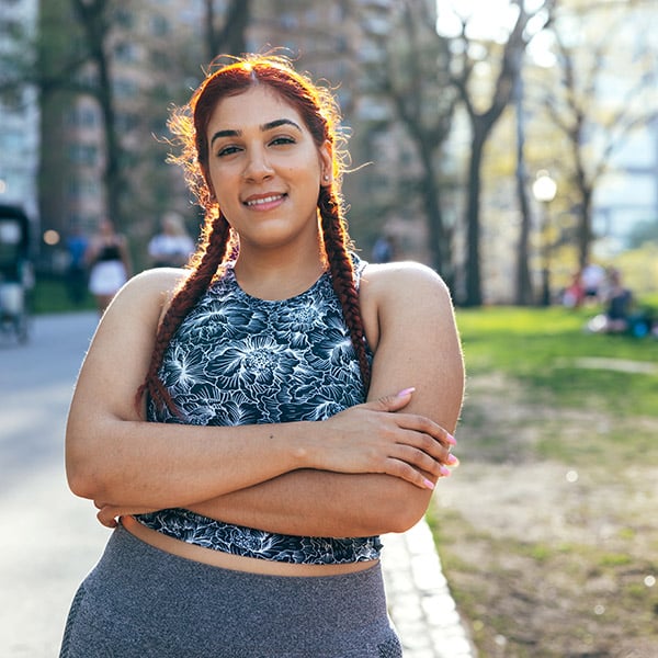 Young Woman In Sports Clothing In Central Park