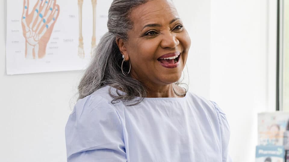 Female Patient Shakes Hands With The Female Healthcare Professional