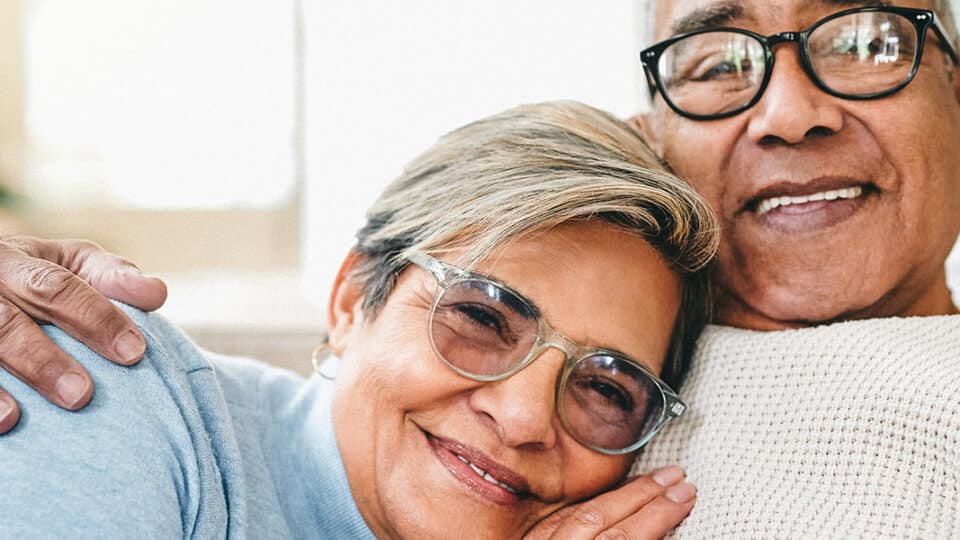 Shot Of A Senior Couple Relaxing On The Couch At Home