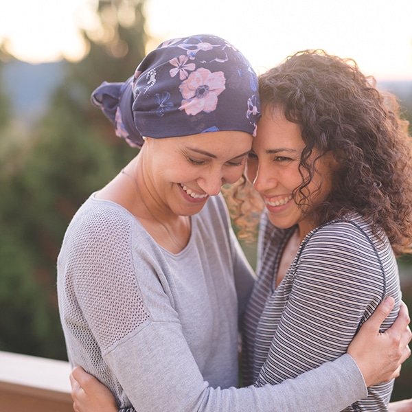 Beautiful Woman Battling Cancer Hugs Her Sister Tightly