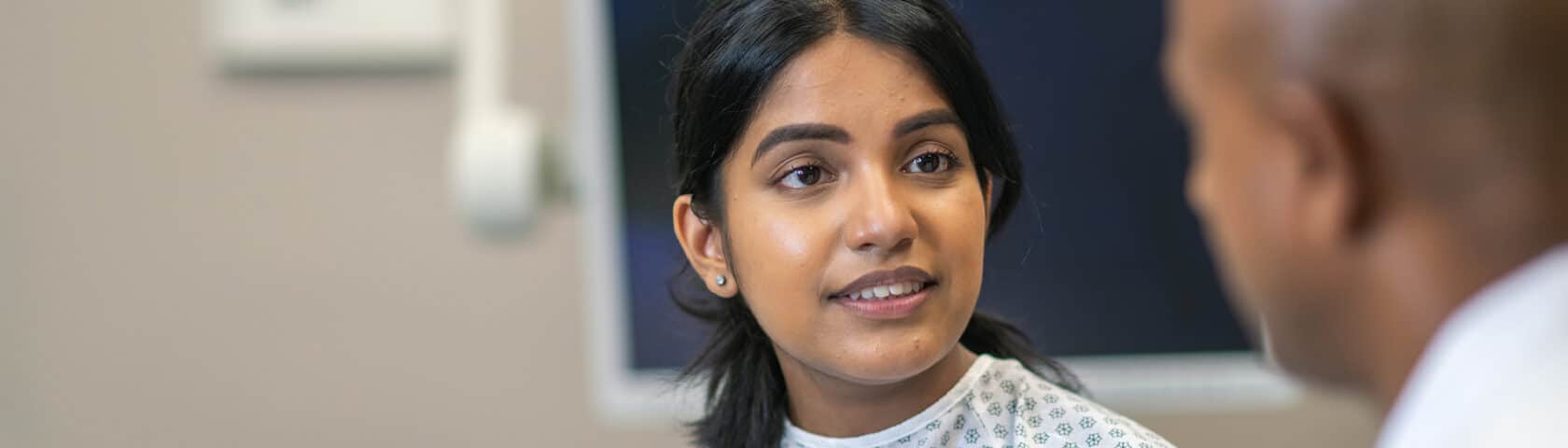 Indian Woman In Consultation With Doctor