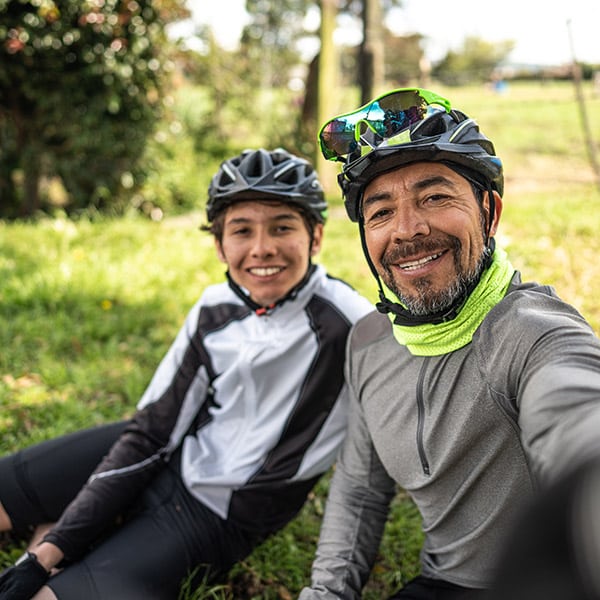 Cyclist Father And Son Taking A Selfie Or Filming In A Rural Place Camera Point Of View