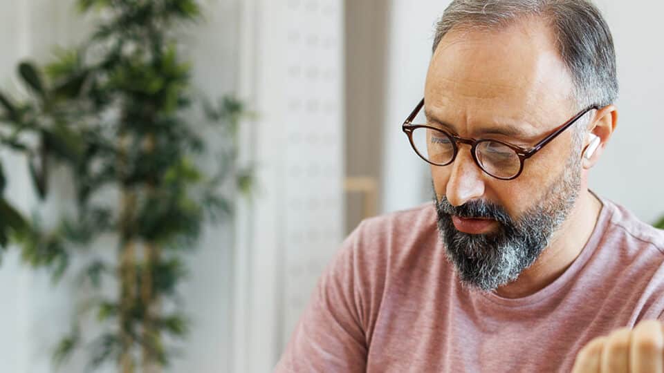 Mature Man Checking Blood Pressure While Having Online Meeting With A Doctor