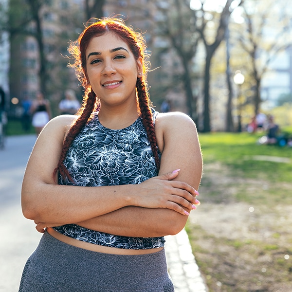 Young Woman In Sports Clothing In Central Park