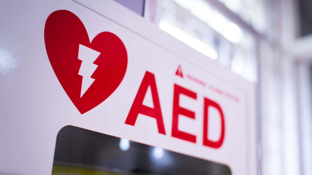 An Automated External Defibrillator (aed) In A White Box Is An Emergency Defibrillator For People In Cardiac Arrest